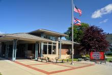 outside image of the library building with blue sky in the background